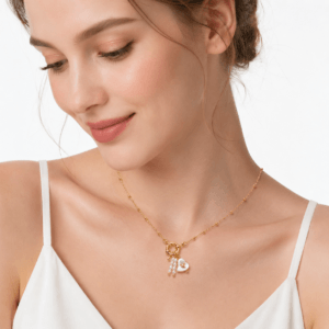 Model wearing 14K gold vermeil necklace with heart charm pearl drops | Pearl Jewelry Manufacturer | Ideal Pearl Co.