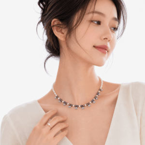 Model wearing 14K gold vermeil shooting star freshwater pearl pendant necklace | Pearl Jewelry Boutique | Ideal Pearl Co.