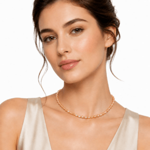 Model wearing golden orange rice pearl twisted strand necklace | Pearl Jewelry Supplier | Ideal Pearl Co.