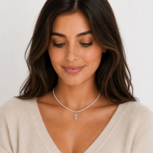 Model wearing pearl necklace silver feather leaf pendant | Pearl Jewelry Boutique | Ideal Pearl Co.