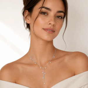 Woman wearing pearl lariat necklace with delicate Y-drop pendant │ Ideal Pearl Co.